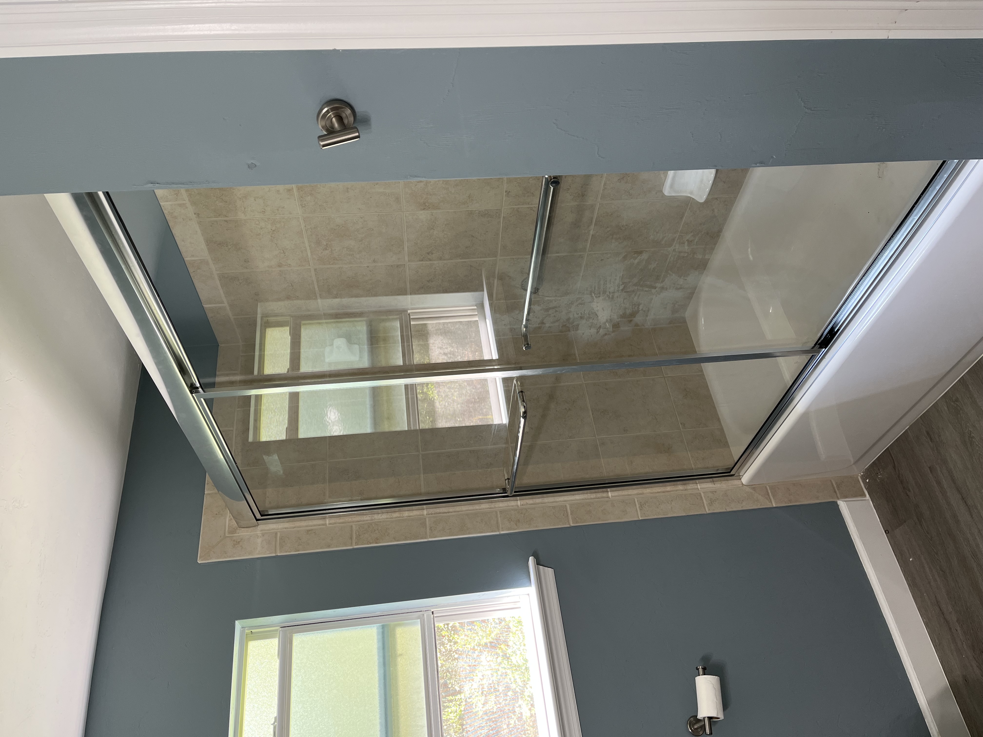 Framed light glass bypass shower door